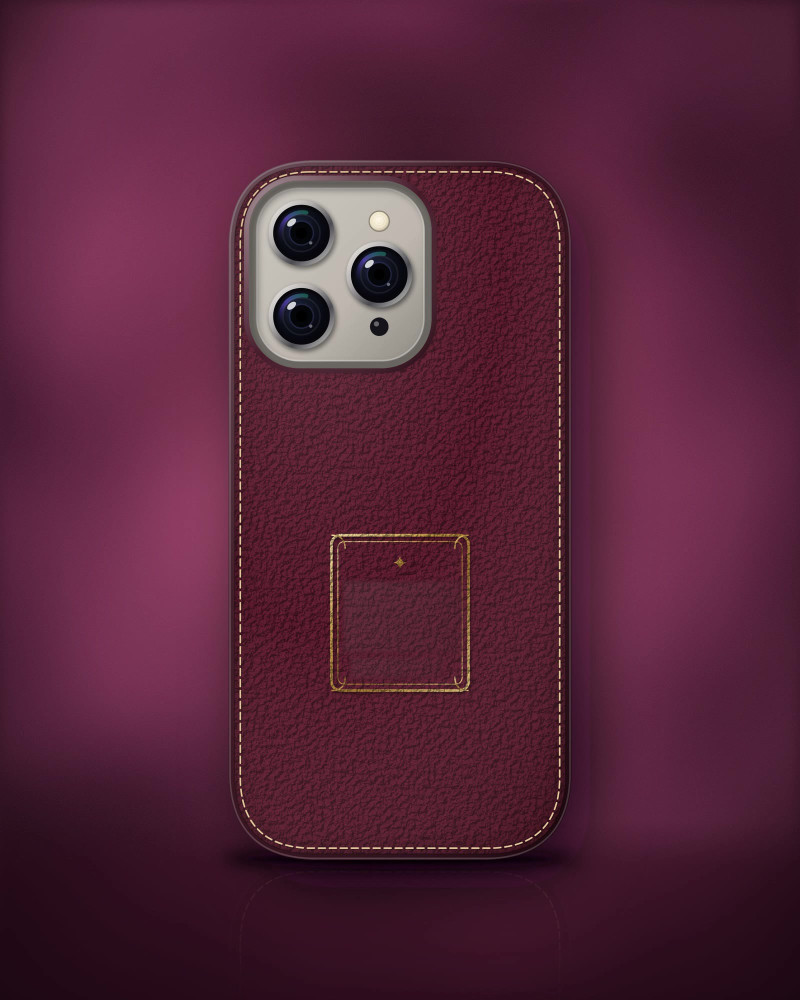 The Heirloom Monogram Case in wine vegan leather, its gold-foil crest ready for initials.