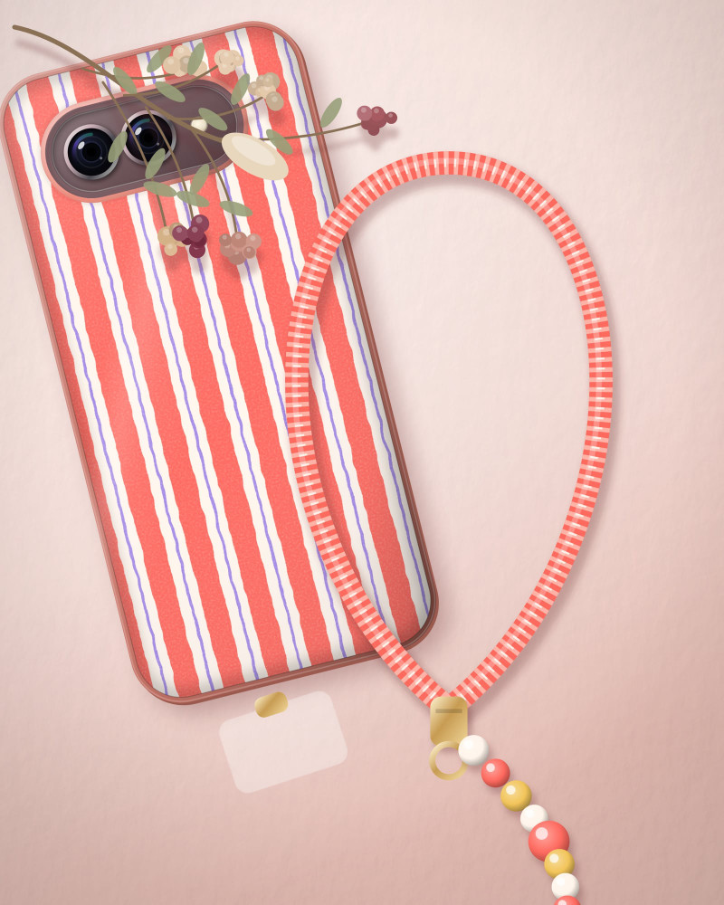Coral & Blush wrist strap beside a case