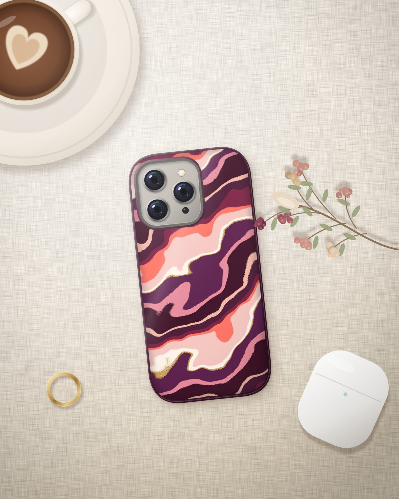 Wine Swirl Case on iPhone 16 Pro, flat-lay