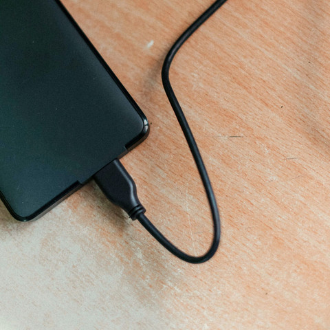 Slim black power bank with cable