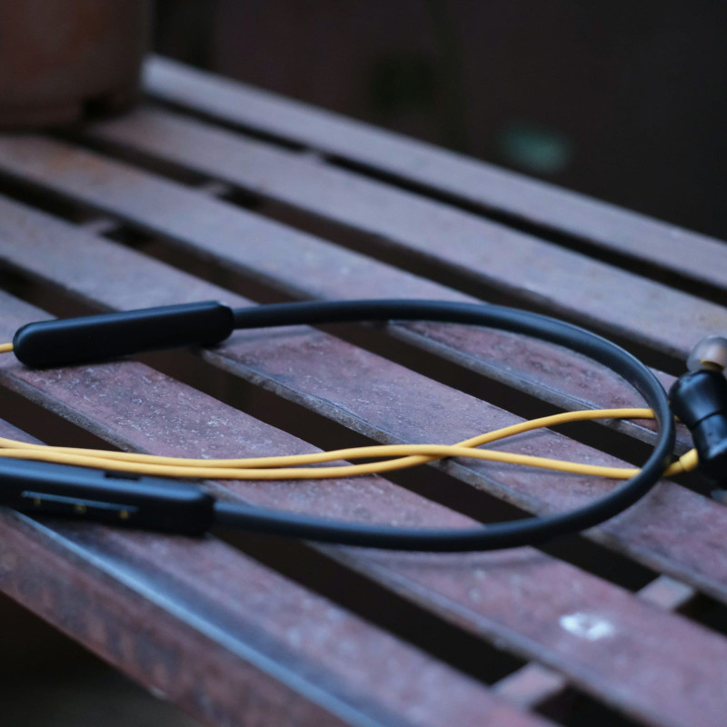 Neckband earphones on a bench