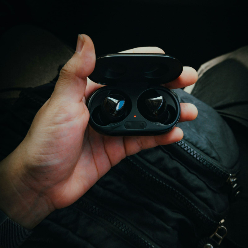 Earbuds case in hand